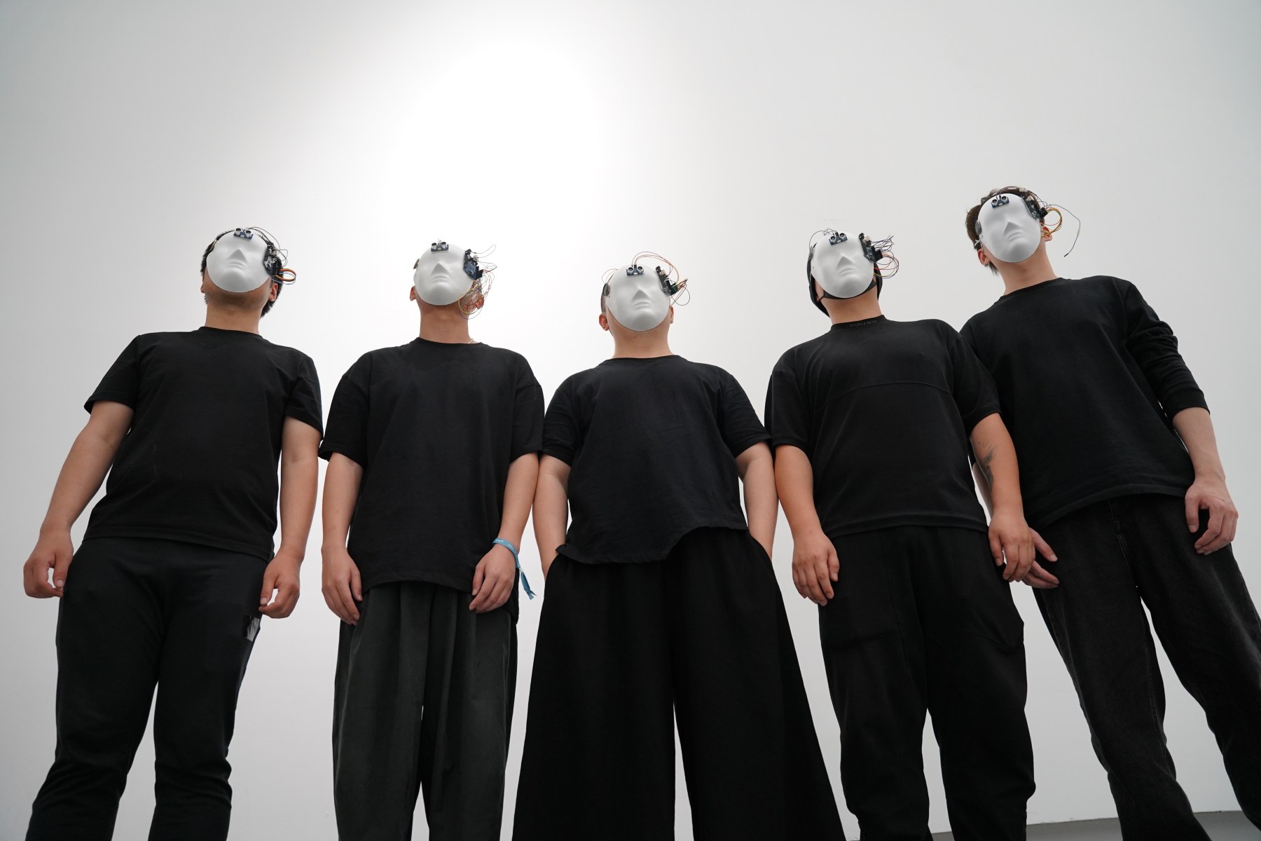 Blind Opera performers wearing programmed eyeless masks