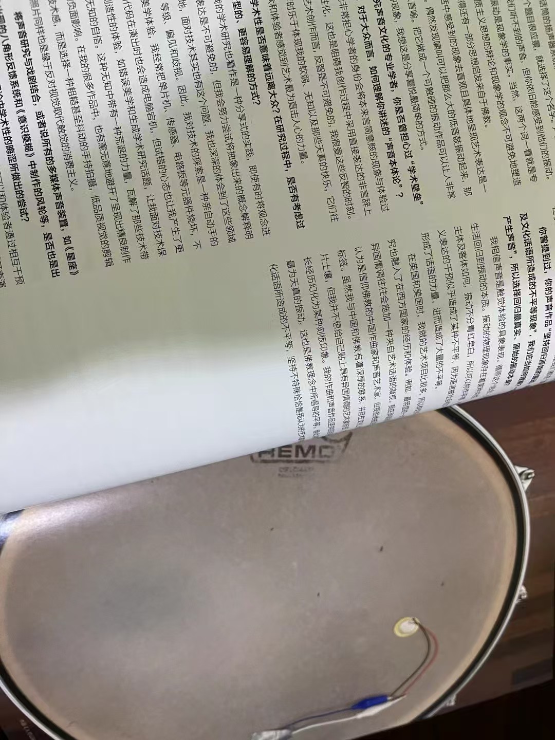 Trajectories of Vibration article page photographed over a drum